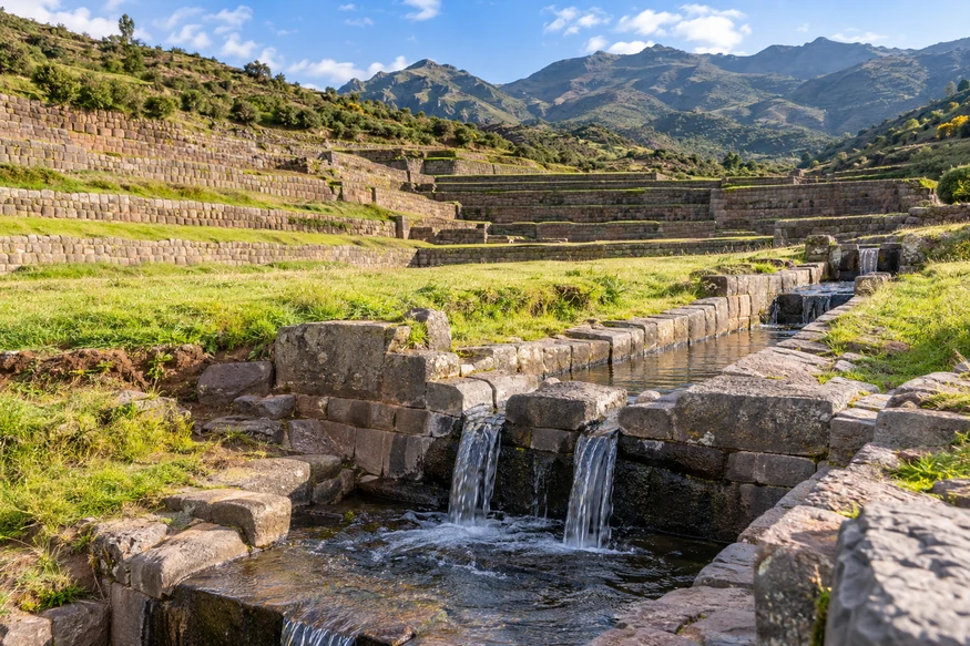 Tipon Inca terraces and flowing stone water channels near Cusco Peru